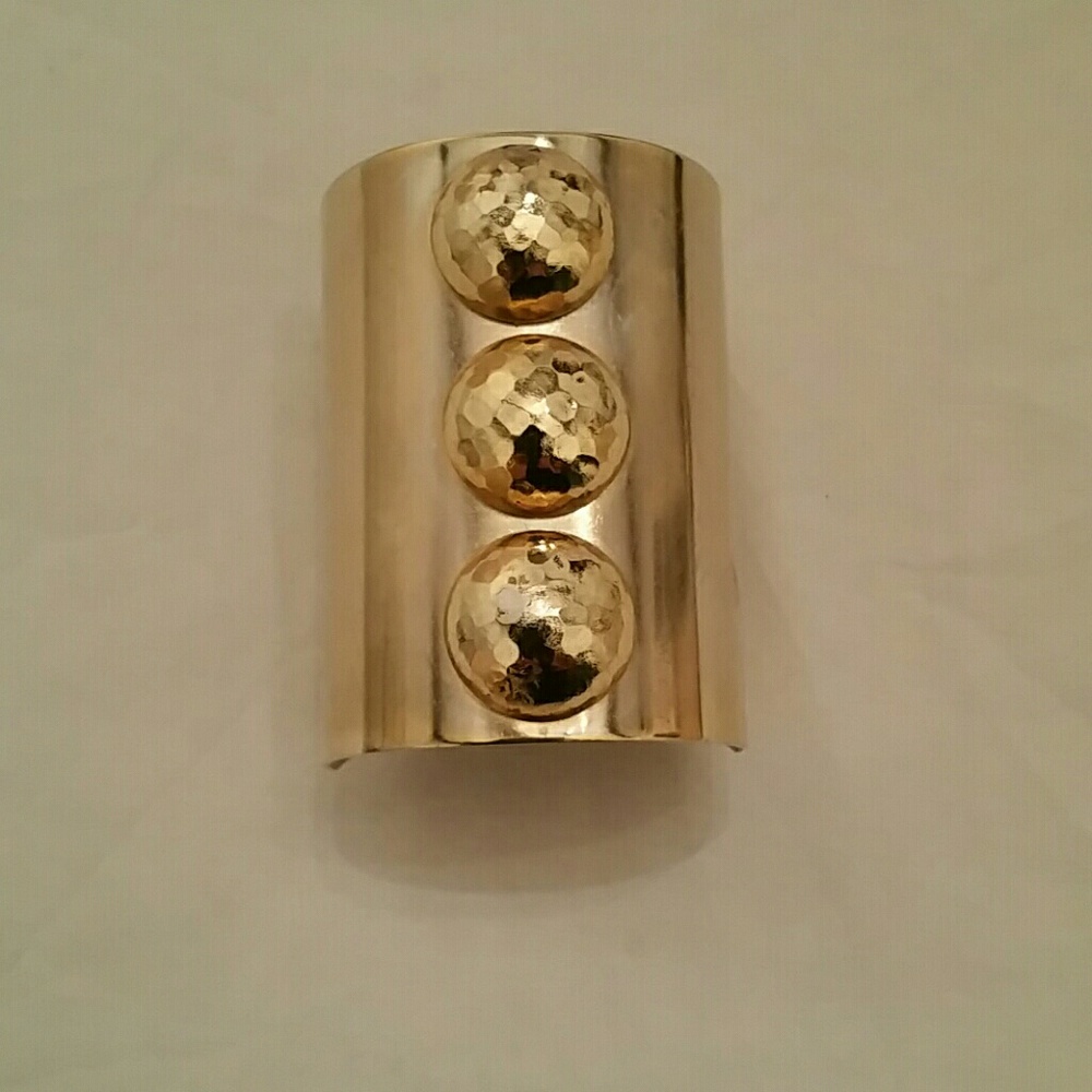 Gold tone metal bracelet cuff
